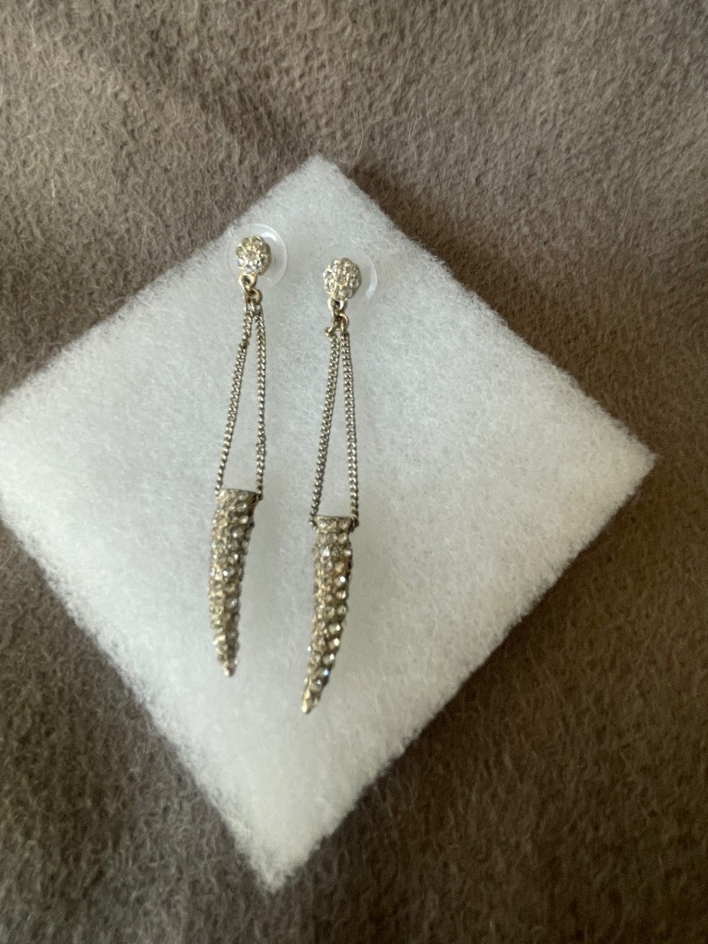 Gold tone jeweled horn earrings